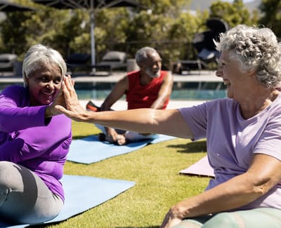Residents participating in an outdoor yoga class