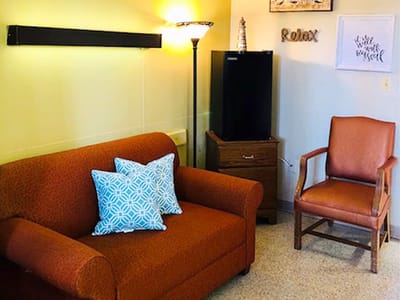 Cozy lounge area with a sofa and armchair