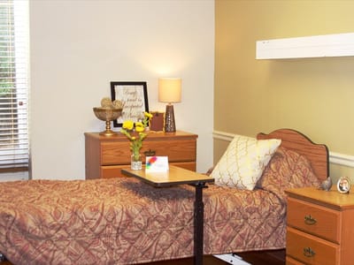 Cozy resident room with a bed and flowers