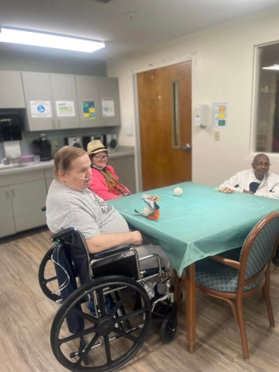 Residents enjoying a casual activity in the common room
