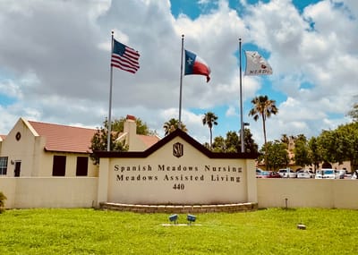 Exterior view of the facility with flags