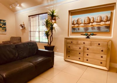 Cozy lounge area with a sofa and wall artwork