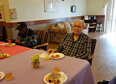 Residents enjoying snacks in a common area