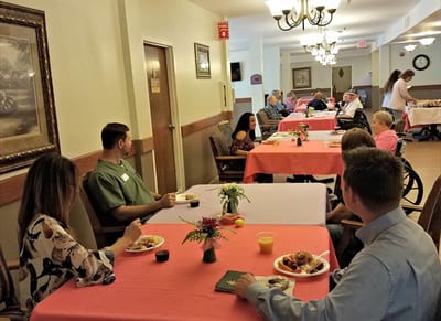 Residents enjoying a meal in the dining room