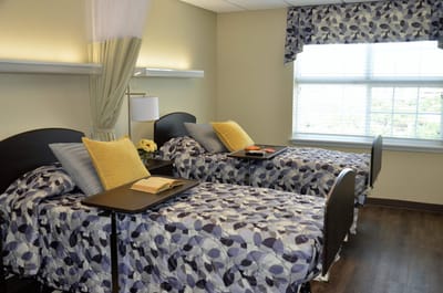 Cozy private resident room with twin beds and sunlight