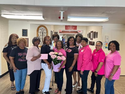 Residents and staff celebrating with flowers