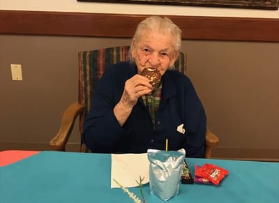 Resident enjoying a snack in a communal area