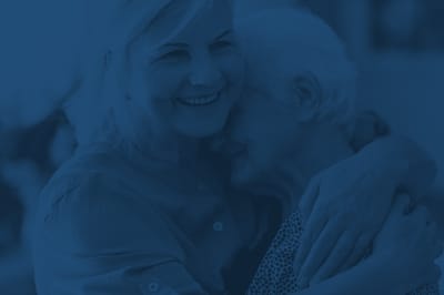 Candid moment between a caregiver and a senior resident