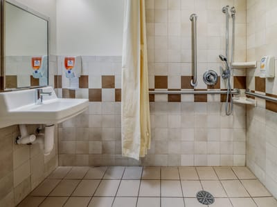 Thatcher Brook Rehabilitation & Care Center, Nursing Home in Clearfield, UT — Accessible bathroom with grab bars and shower facilities