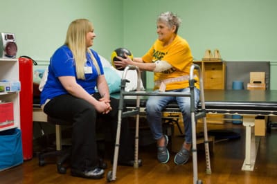 Resident engaging in therapy with staff member