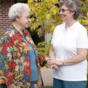 American Lutheran Home-Mondovi, Nursing Home in Mondovi, WI — Two women interacting outside in a garden setting