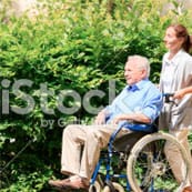 American Lutheran Home-Mondovi, Nursing Home in Mondovi, WI — Senior man in wheelchair being assisted outdoors
