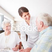 American Lutheran Home-Mondovi, Nursing Home in Mondovi, WI — Caregiver interacting with elderly residents in a communal space