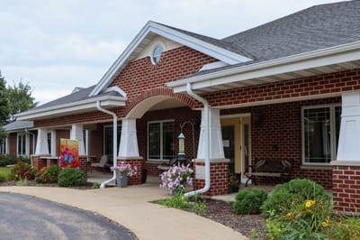 Exterior view of an assisted living facility with garden