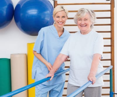 Therapist assisting a resident in an activity room