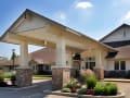 Alden Estates of Jefferson, Nursing Home in Jefferson, WI — Covered entrance of a senior living facility with landscaping