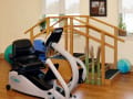 Alden Estates of Jefferson, Nursing Home in Jefferson, WI — Fitness equipment in a bright exercise area with stairs