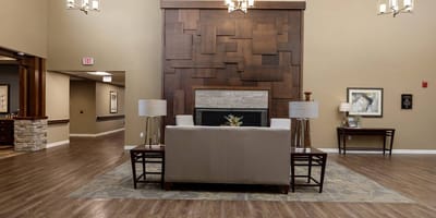 Common area with seating and decor in a nursing home