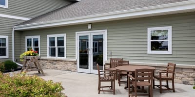 Outdoor seating area with tables and flowers
