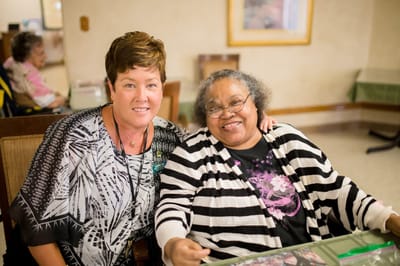 Staff member with a resident in a common area