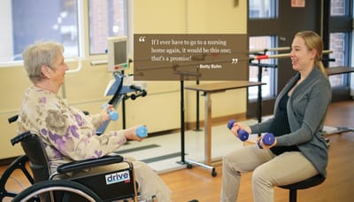 Senior resident and staff member participating in an exercise activity