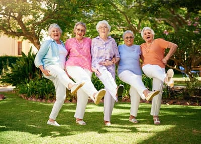 Meadowbrook Senior Living at Black River Falls, nursing home in Black River Falls, WI — Group of smiling senior women with playful poses outdoors