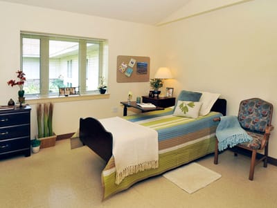 Alden Estates of Jefferson, Nursing Home in Jefferson, WI — Cozy senior living bedroom with natural light and decor