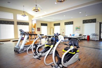 Fitness area with exercise machines and natural light