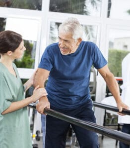 Arbor Lake Health & Rehab, LLC, Nursing Home in Auburn, AL — Physical therapy session with a patient and caregiver