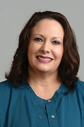 Limestone Nursing and Rehabilitation Center, Nursing Home in Athens, AL — Smiling woman in a teal blouse with brown hair