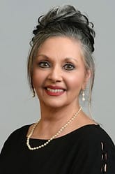 Limestone Nursing and Rehabilitation Center, Nursing Home in Athens, AL — Female staff member with a pleasant smile and jewelry