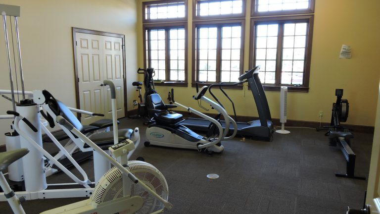 Interior view of a fitness area with exercise equipment