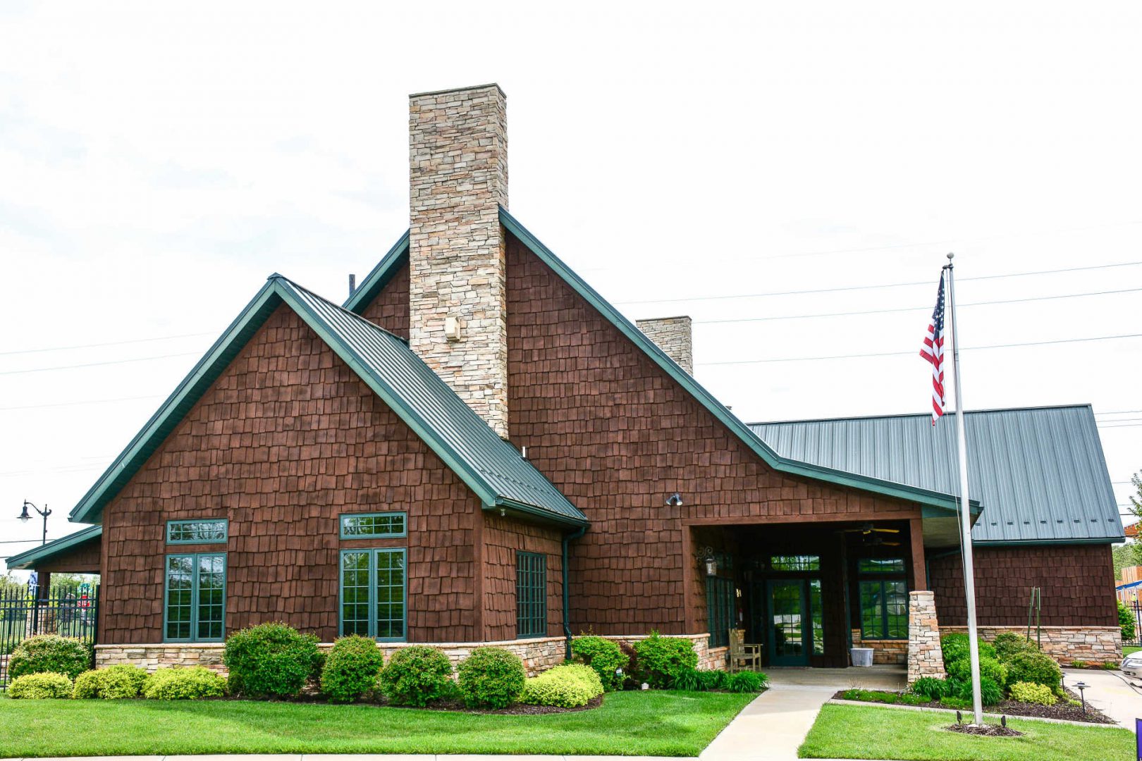 Exterior view of a senior living facility with landscaped entrance