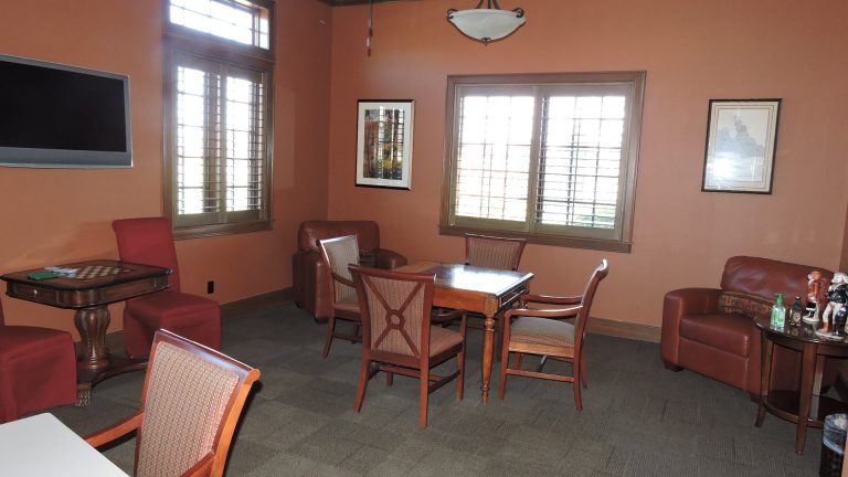 Cozy lounge area with comfortable seating and artwork