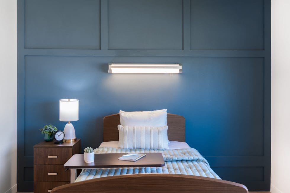 Private bedroom with light blue accents and cozy decor