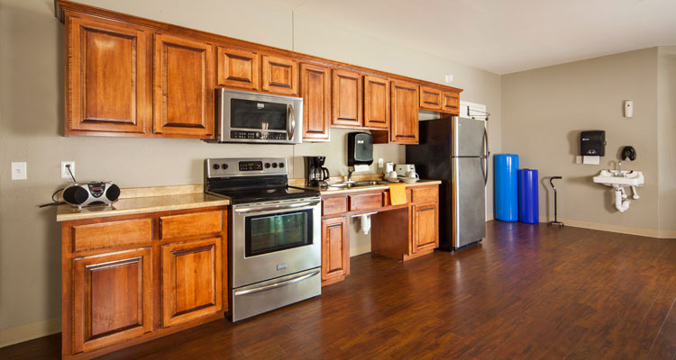 Modern kitchen space with wooden cabinets and appliances