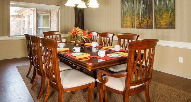 Dining area with a large table and chairs
