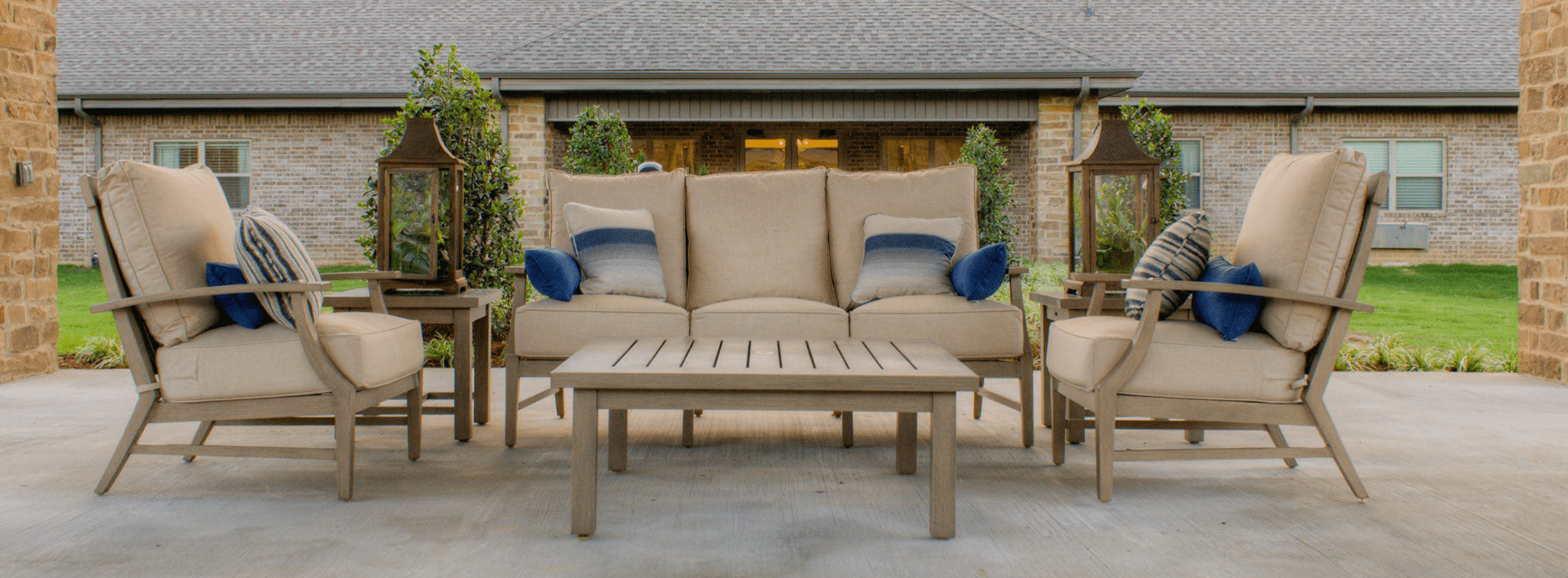 Outdoor seating area with couches and plants