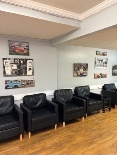Interior lounge area with black chairs and decor