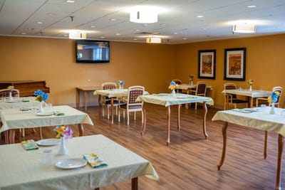 Dining area with tables and flower decorations