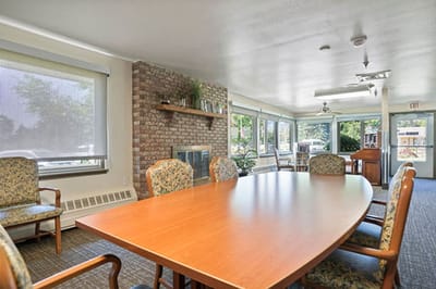 Interior view of a sunny common area with seating