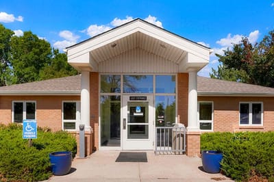 Entrance of a senior living facility with signage
