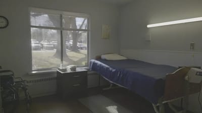 Private resident room with bed and window