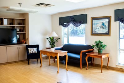 Bright common area with furniture and decorative plants