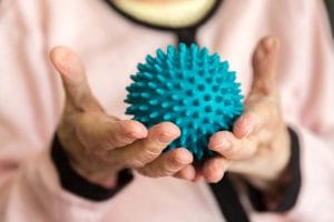 Fort Valley Health and Rehab, Nursing Home in Fort Valley, GA — Hands holding a textured blue stress ball