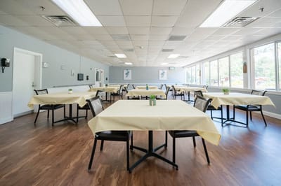 Bright dining area with tables set for meals