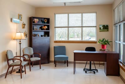 Bright interior with seating and a desk