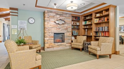 Cozy lobby area with seating and a fireplace