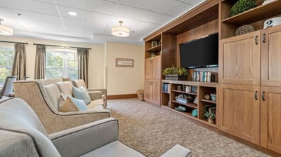 Common area with seating and bookshelves