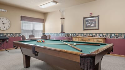 Views of a billiards table in an activity room